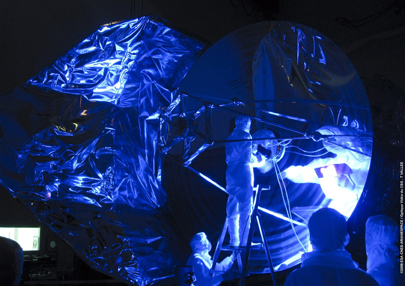 Herschel's 3.5-meter-diameter mirror is checked using ultraviolet light in the S1B clean room at Europe's Spaceport Herschel's 3.5-meter-diameter mirror is checked using ultraviolet light in the S1B clean room at Europe's Spaceport