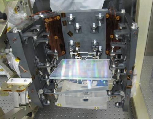 Light enters at the bottom and leaves at the top, towards the Focal-Plane Assembly (FPA). The bottom element shown is wedged lens 1 (WL1). Above that, prism 2 (PR2) has been mounted. The top element in this picture is the grating. Three more elements remain to be integrated: prism 3 (PR3), wedged lens 4 (WL4), and the bandpass-filter plate (which is the first element in the train, at the very bottom). ***** 27 April 2011 ***** credits: Astrium