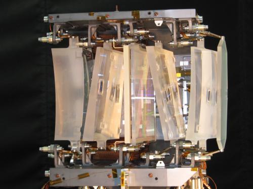 The optical module of the radial-velocity spectrometer, containing a grating plate (middle), four fused-silica prismatic lenses, as well as a bandpass-filter plate (far right). ***** 5 September 2011 ***** credits: Astrium