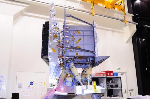 This photograph shows a side view of the Gaia focal plane assembly (FPA) structural model (SM) in the cleanroom at INTESPACE, Toulouse, France. In October 2010, the FPA SM underwent a series of mechanical tests that demonstrated that it is structurally fit for flight. In the photograph, the large silver-coloured panel (on the left) is a radiator used for passive cooling of the FPA electronics (black) that are housed behind the focal plane. The focal plane is inside the box-shaped radiator to the right. The yellow 'tubes' underneath the FPA are the FPA support struts that are used to mount the FPA on the Gaia torus. ***** 19 November 2010 ***** credits: Astrium